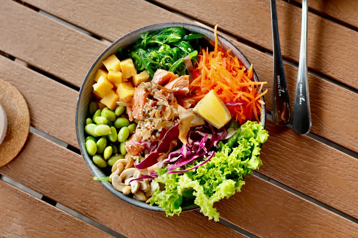 A colorful bowl of fresh vegetables, meat, and fruit from Maui's top food trucks.