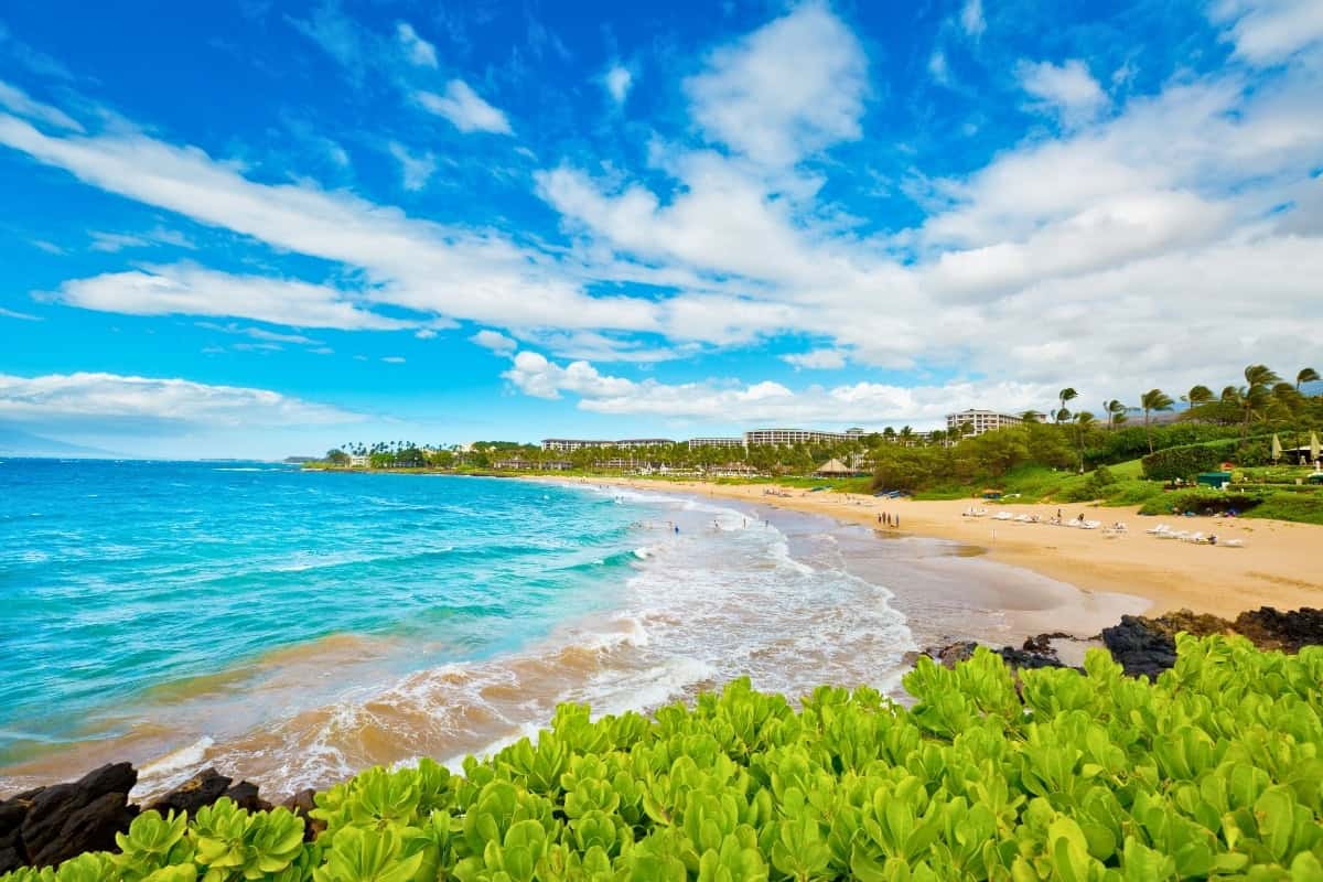 Wailea Beach Scenic view of Wailea Beach, Maui, showcasing soft sand and turquoise waves lapping the shore.